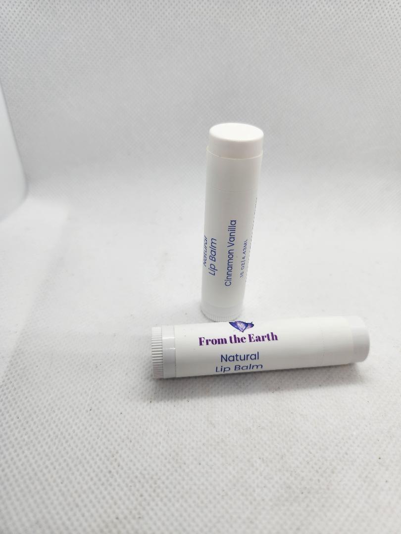 several lip balms on a white background