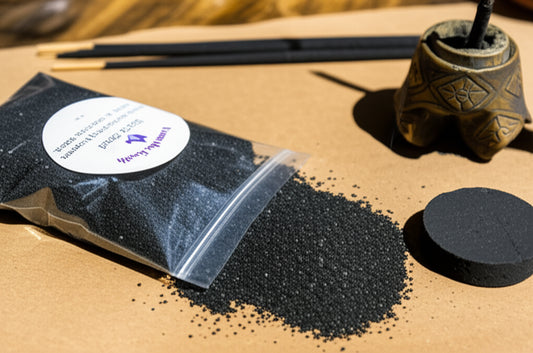 bag of black sand on a table with incense  holder