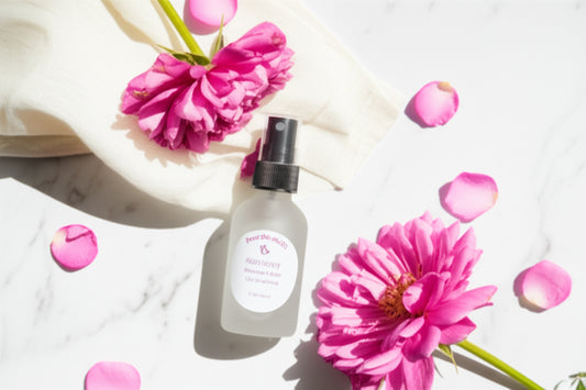 body spray surrounded by flowers