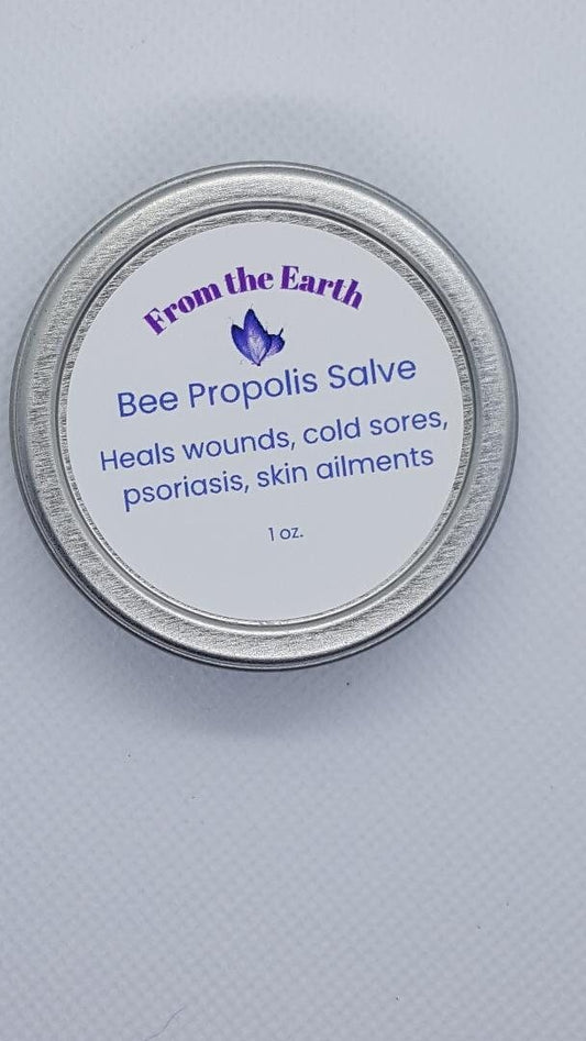 bee propolis salve tin on white background
